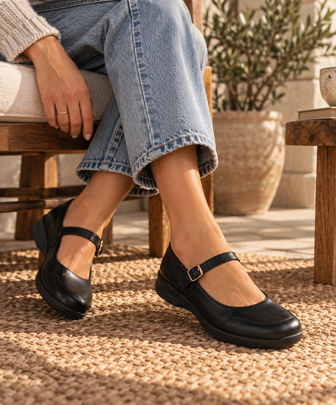 Black Mary Jane flats worn with jeans